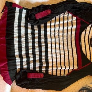 Really cute pre-loved top. The colors are striking.